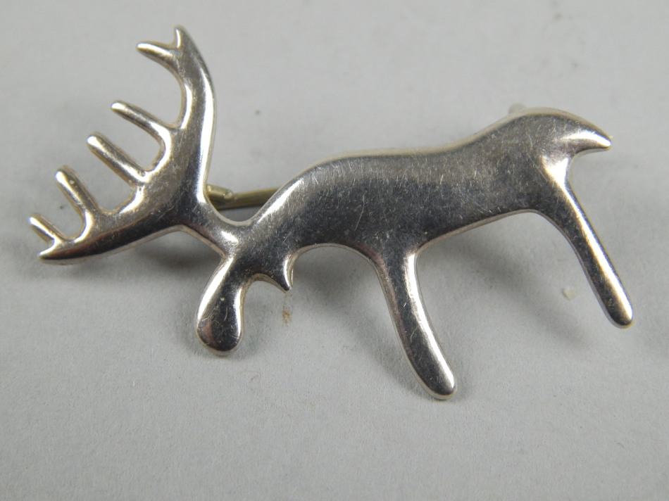 Appraisal: A stag brooch white metal marked cm wide Provenance Butterfields