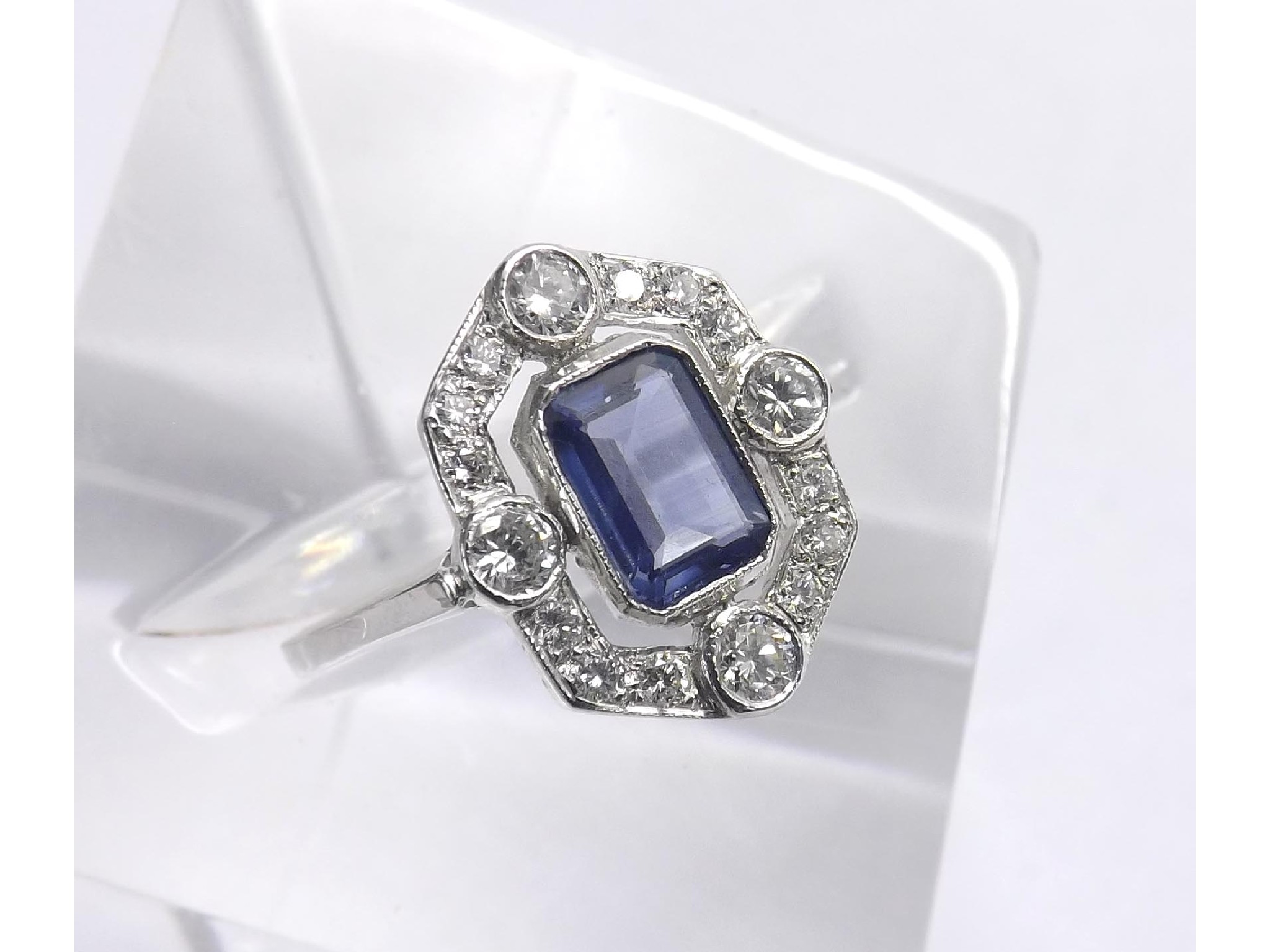 Appraisal: Attractive k white gold sapphire and diamond dress ring emerald-cut