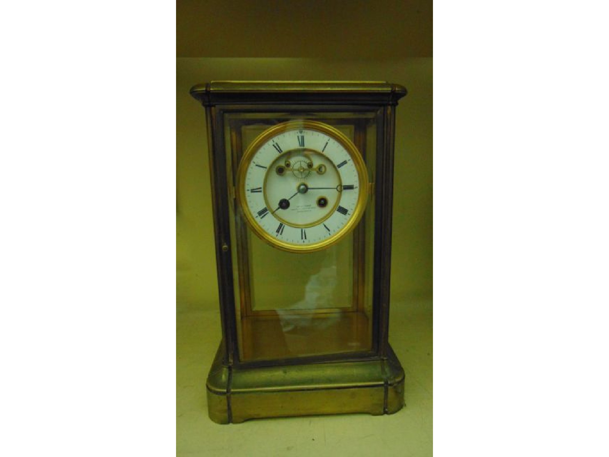 Appraisal: th century brass framed four pane mantle clock with enamel