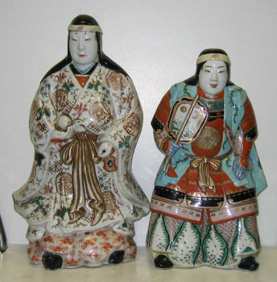 Appraisal: TWO MASSIVE JAPANESE PORCELAIN FIGURES Each wearing a band in