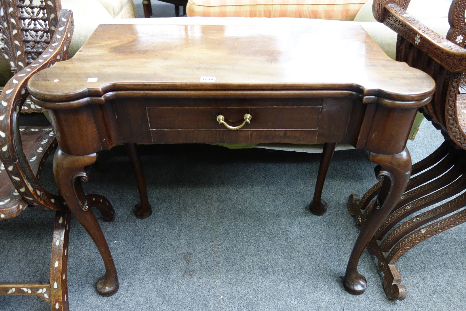 Appraisal: A George II and later mahogany card table with shaped