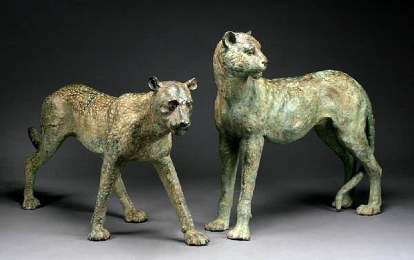 Appraisal: A pair of patinated bronze figures of cheetahs Each standing