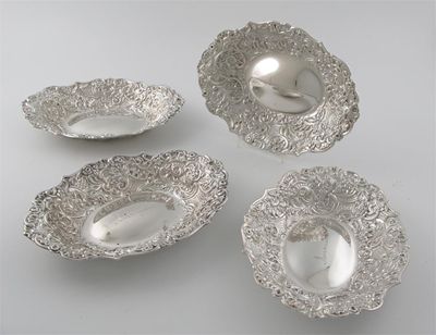 Appraisal: A set of four late Victorian embossed dishes of shaped