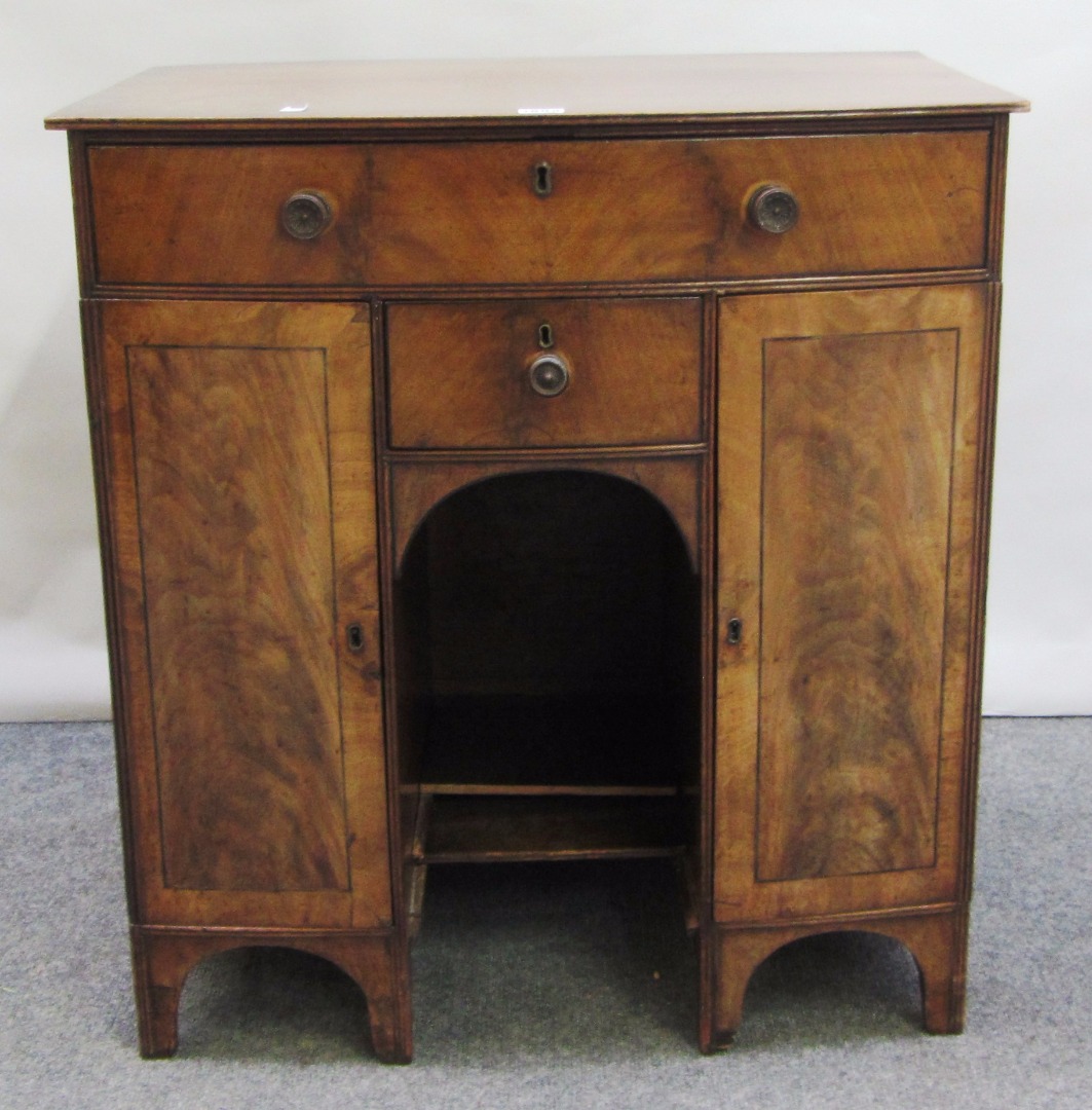 Appraisal: A George III mahogany bow front knee hole side cupboard