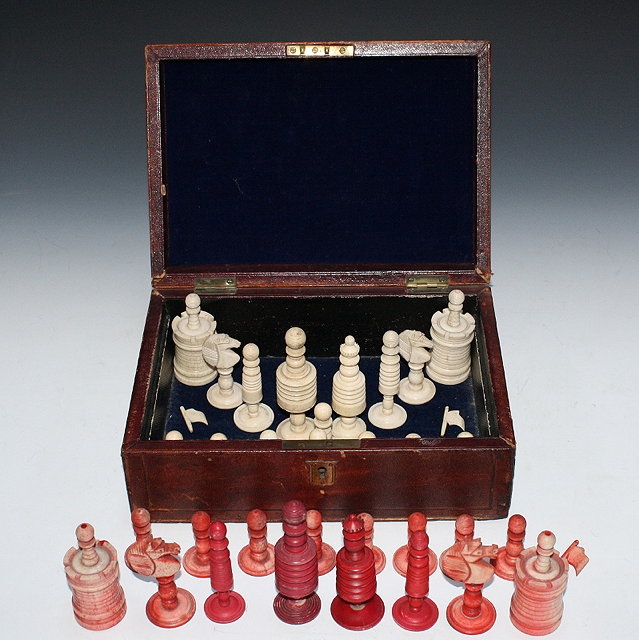 Appraisal: A TURNED AND STAINED BONE CHESS SET cm high with