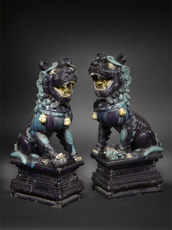 Appraisal: A massive pair of Chinese fahua pottery models of Buddhistic