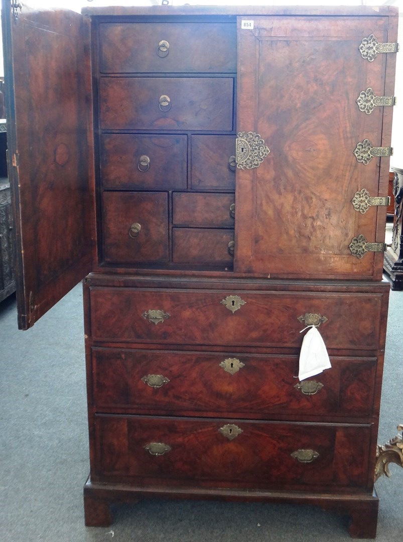 Appraisal: An th century and later featherbanded walnut cabinet on chest