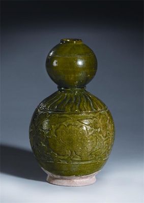 Appraisal: A Chinese green-glazed pottery double gourd vase the lower bulb