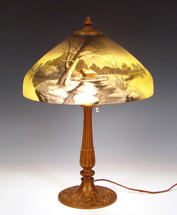 Appraisal: SCENIC REVERSE PAINTED LAMP First quarter th C Bronzed metal