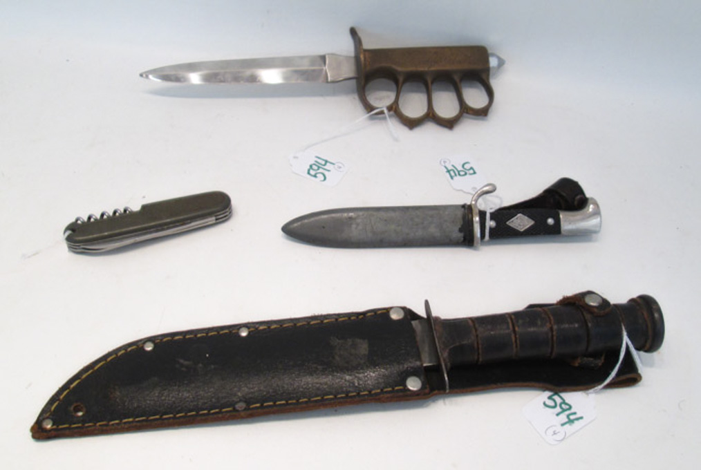 Appraisal: FOUR COLLECTIBLE KNIVES US model style Knuckle Buster trench knife