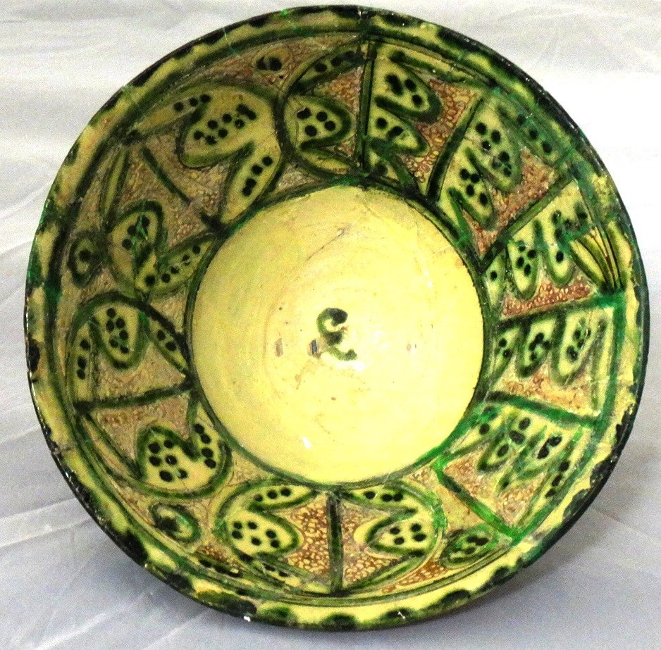 Appraisal: An 'Amol' incised green and manganese-glazed bowl Iran th century