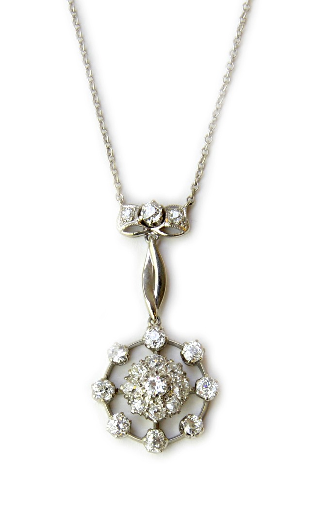 Appraisal: A diamond cluster pendant necklace the centre formed as a