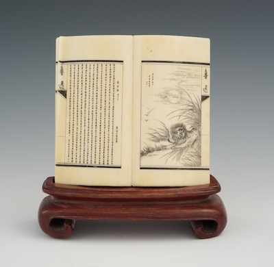 Appraisal: A Miniature Carved Ivory Book Book carved of ivory with