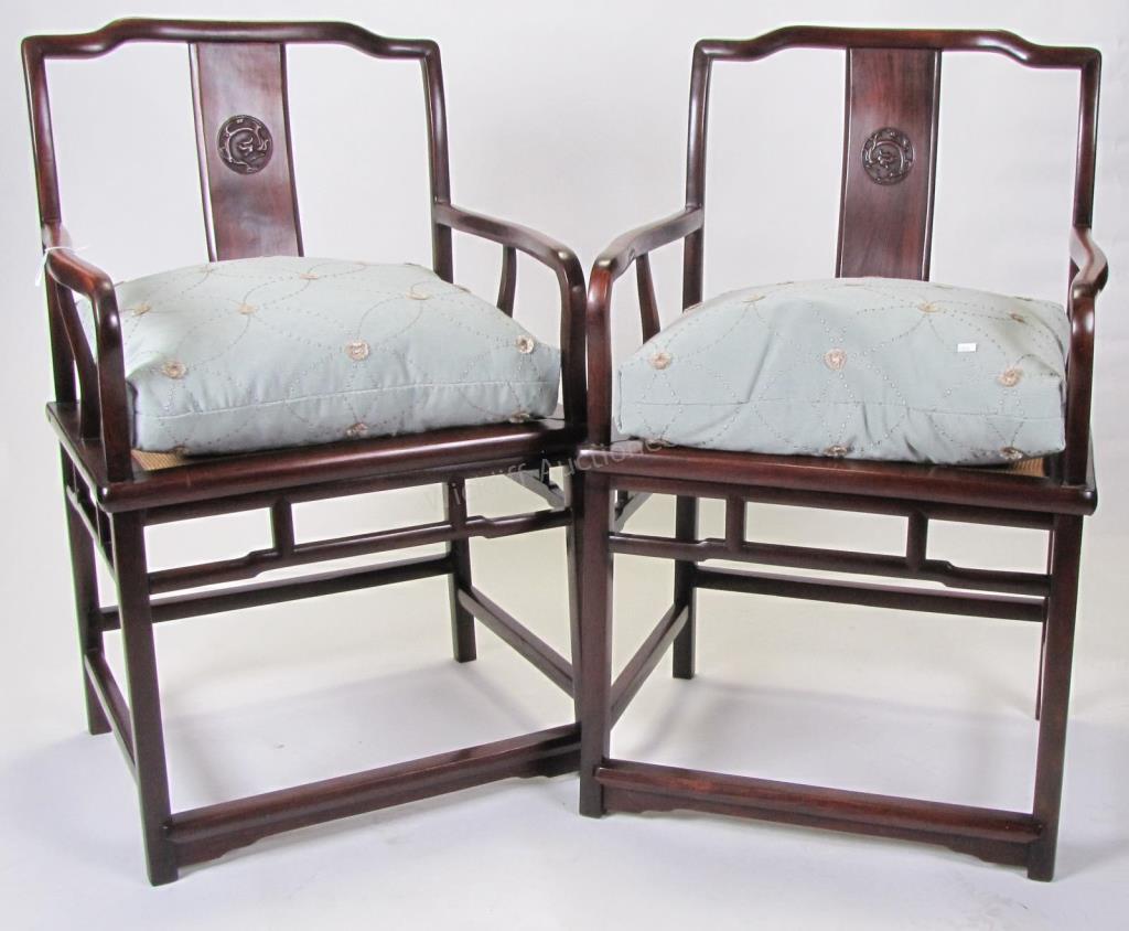 Appraisal: A pair of carved Chinese armchairs dragon carvings on back