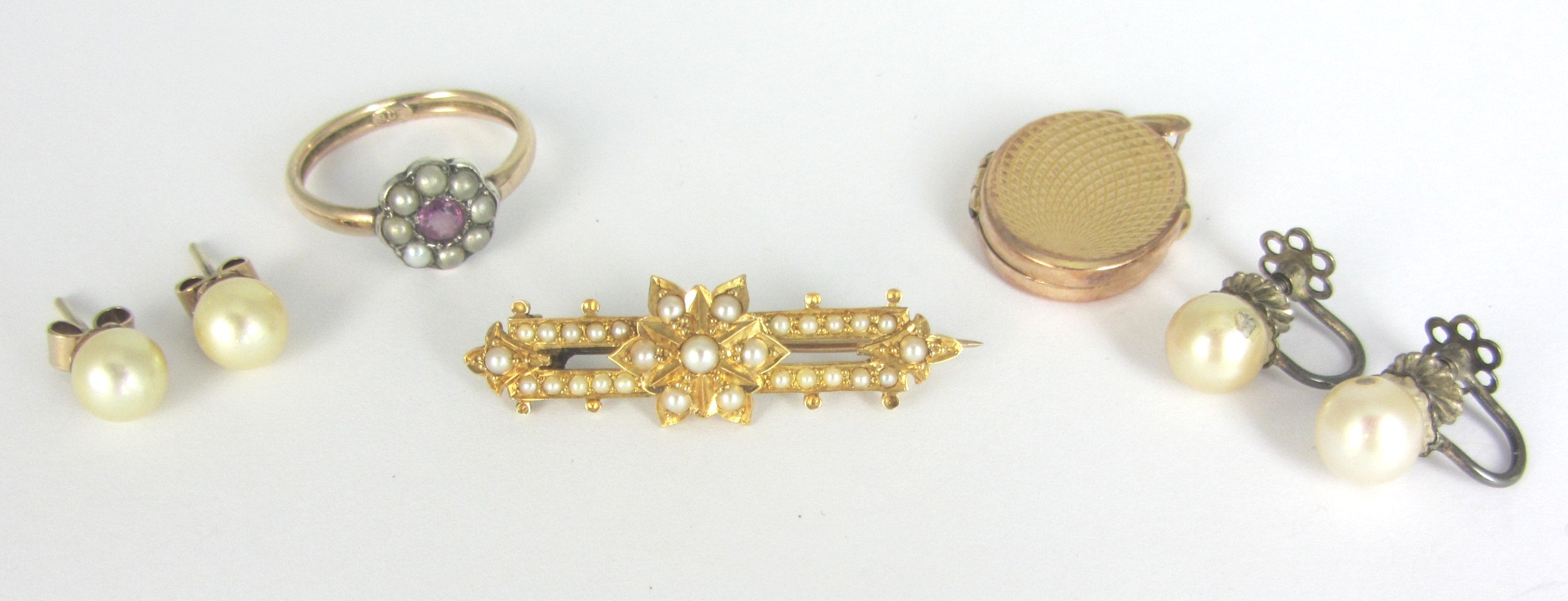 Appraisal: A gold and half pearl set brooch with a flowerhead