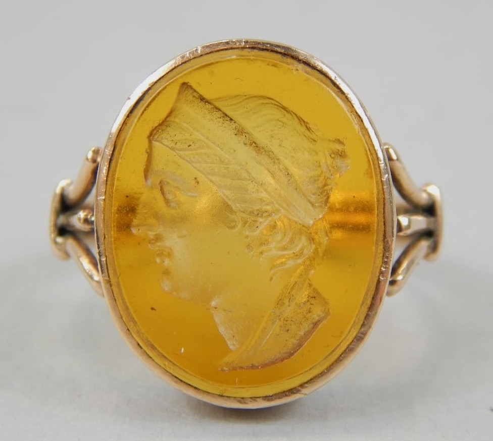 Appraisal: A gentleman's amber stone intaglio ring yellow metal unmarked g