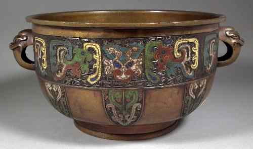 Appraisal: A Chinese bronze and cloisonne enamel two-handled bowl with animal