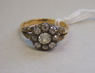 Appraisal: A diamond set nine stone cluster ring mounted with the