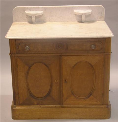 Appraisal: VICTORIAN STYLE MARBLE TOP WASHSTAND marble top with backsplash and