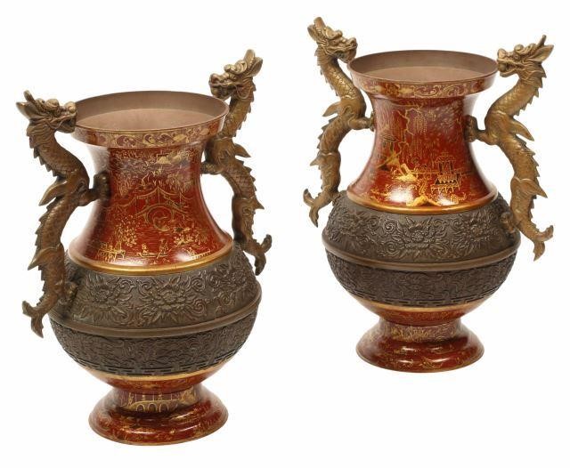 Appraisal: pair Chinoiserie red and patinated bronze urns with dragon-form handles