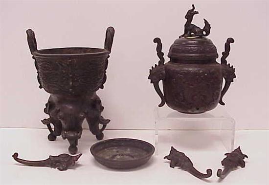 Appraisal: Two Japanese bronze censers the first with twisted loop handles