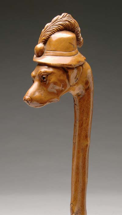 Appraisal: CARVED DOG HEAD CANE One piece wood cane has a