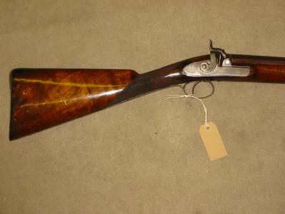 Appraisal: A BORE PERCUSSION SHOTGUN with proof marked single damascus barrel