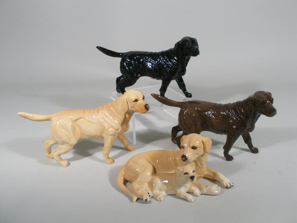 Appraisal: Royal Doulton Dogs Set of Four chocolate labrador black labrador