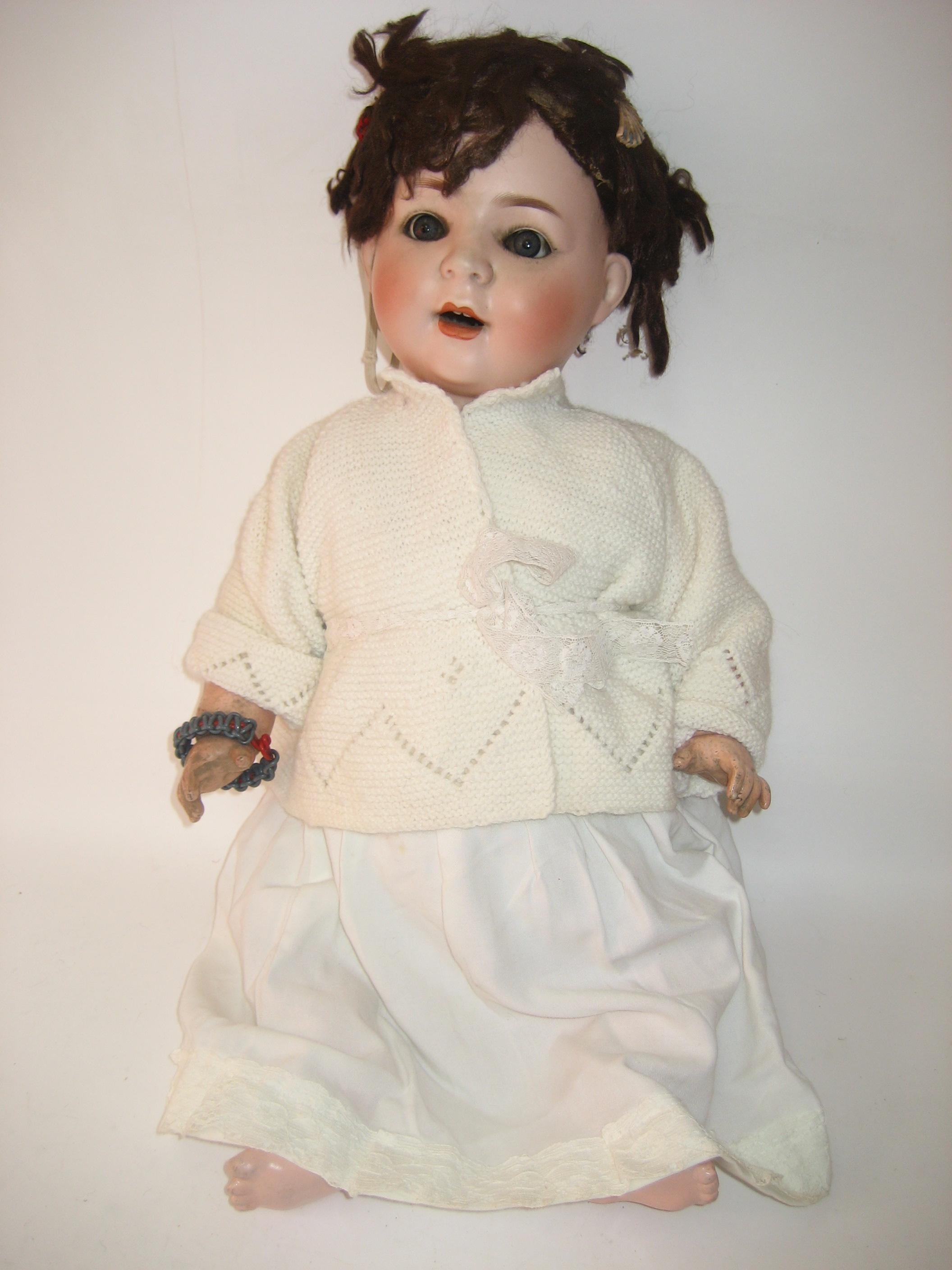 Appraisal: A Burggrub Baby bisque head character girl doll with blue