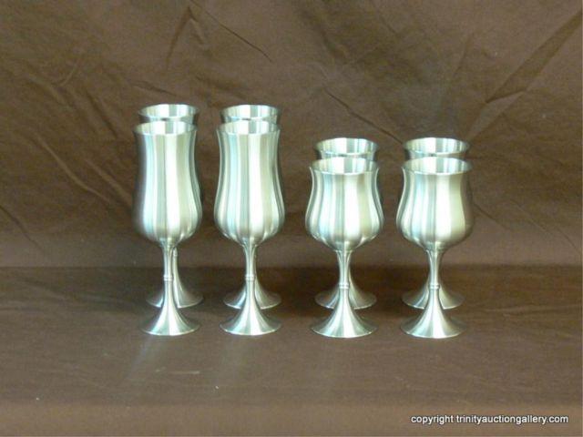 Appraisal: Oriental Brushed Pewter Goblet Set includes champagne and wine stem