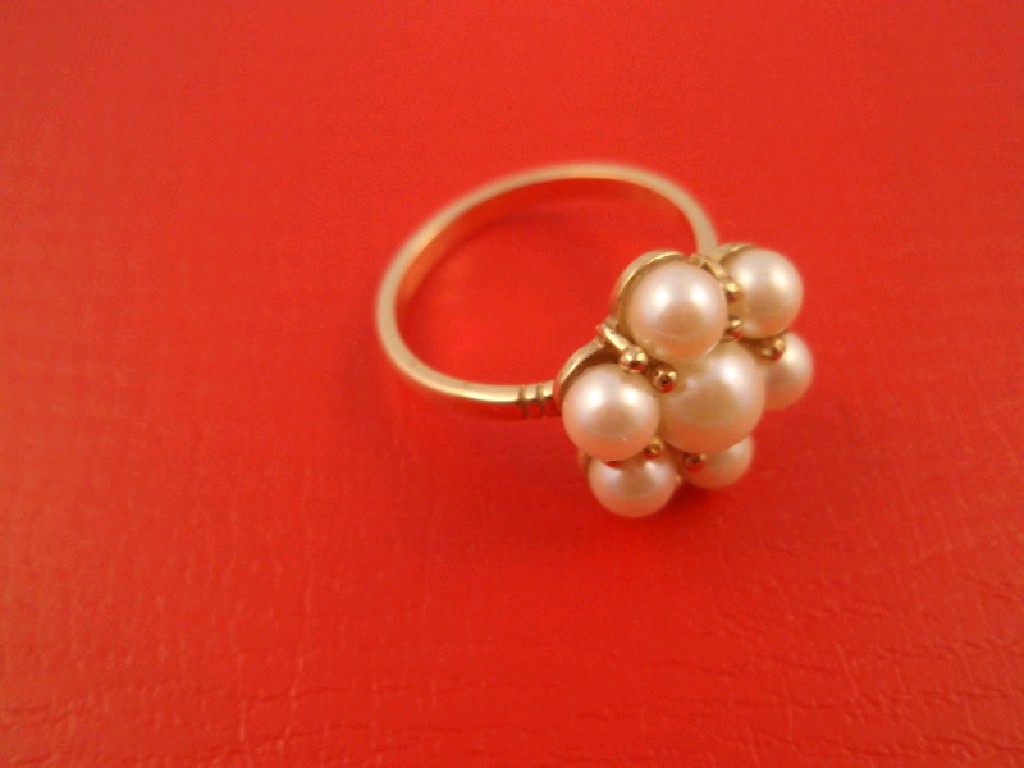 Appraisal: A pearl cluster dress ring seven pearl beads set in