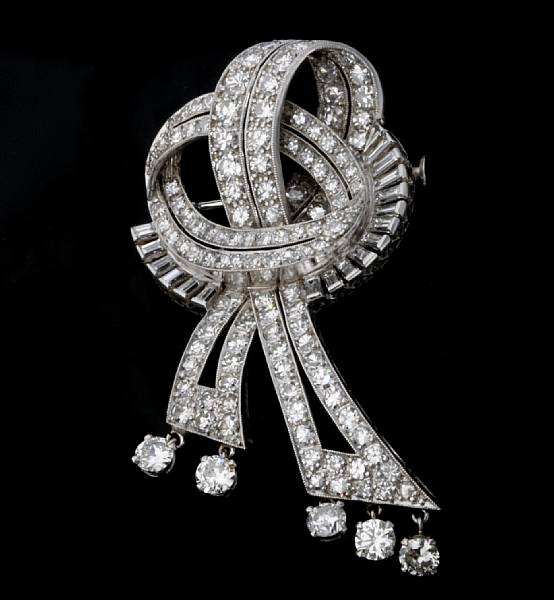 Appraisal: A diamond ribbon brooch circa converts to a pendant estimated