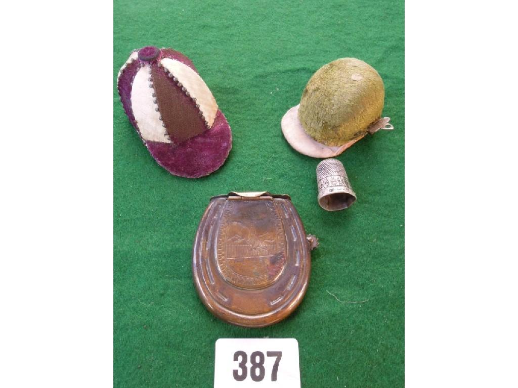 Appraisal: Two miniature Victorian jockeys caps - and a brass horse