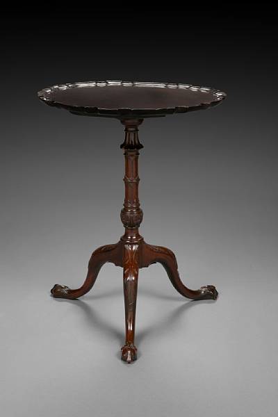 Appraisal: A George III carved mahogany tilt top occasional table second