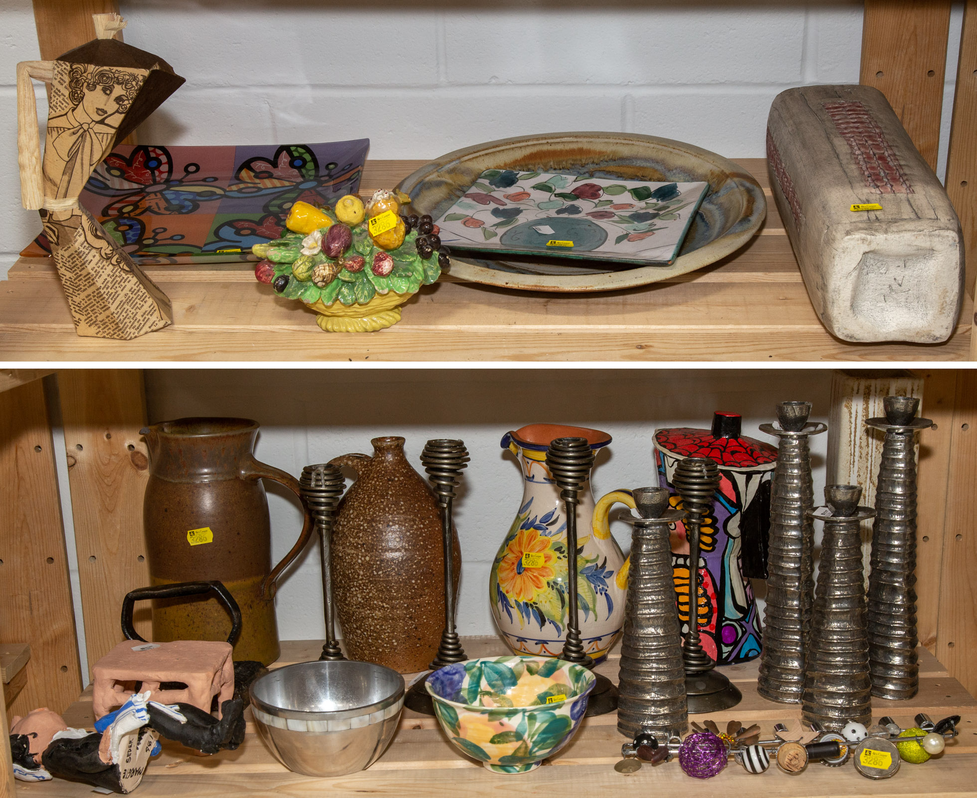 Appraisal: TWO SHELVES OF DECORATIONS COLLECTIBLES Includes candlesticks pitchers iron bowls