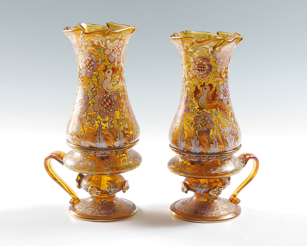 Appraisal: BOHEMIAN ENAMELED AMBER GLASS CANDLE LAMPS Matched pair with floral