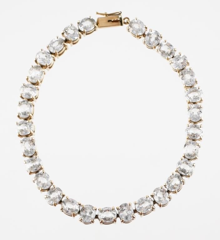 Appraisal: k yellow gold tennis bracelet with oval white sapphires or