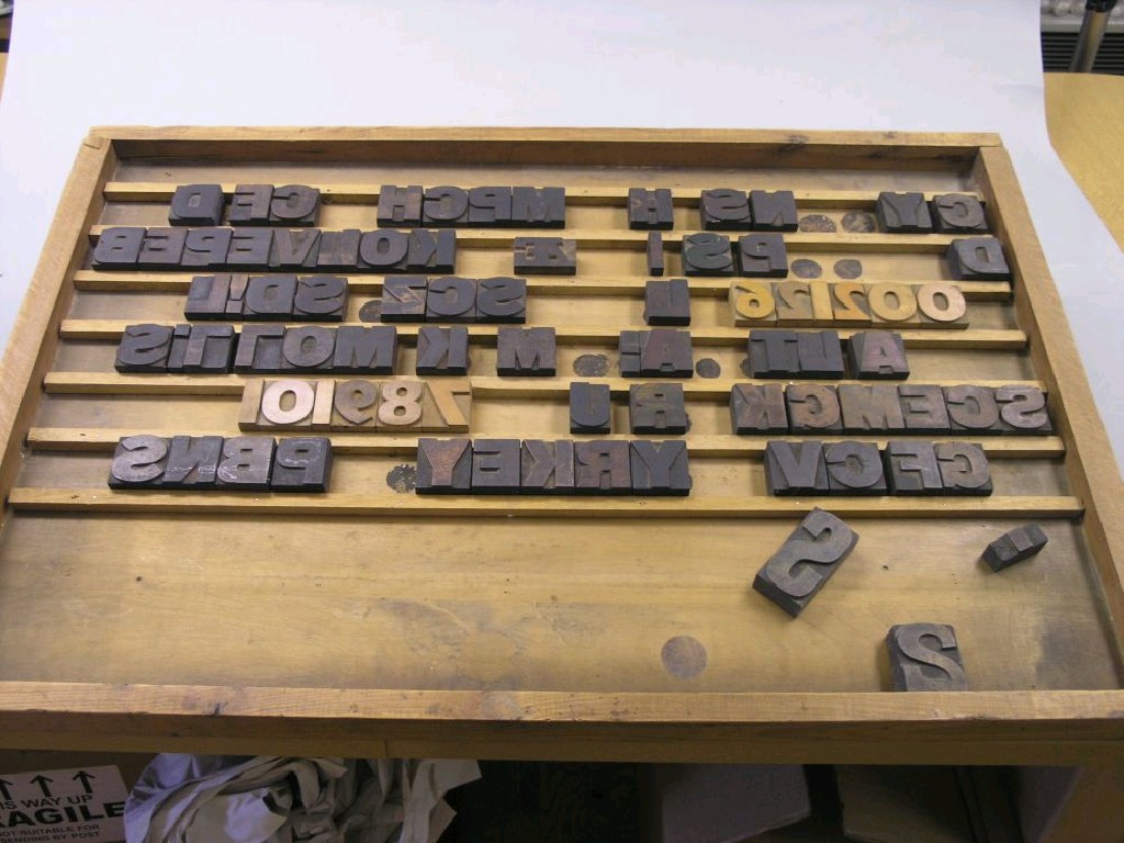 Appraisal: A quantity of wood printing blocks alphabetical and numeric