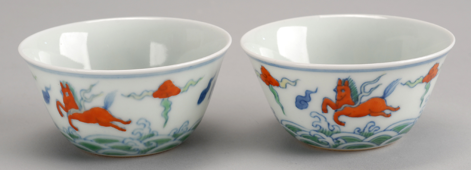 Appraisal: PAIR OF DOUCAI PORCELAIN WINE CUPS With mythical horse decoration