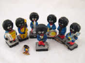 Appraisal: A set of seven Robinsons painted composition Golliwog band figures