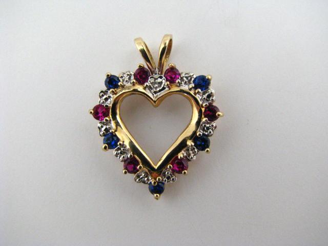 Appraisal: K yellow gold heart pendant with red and blue round