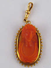 Appraisal: A Victorian carved coral cameo in a yellow metal tests