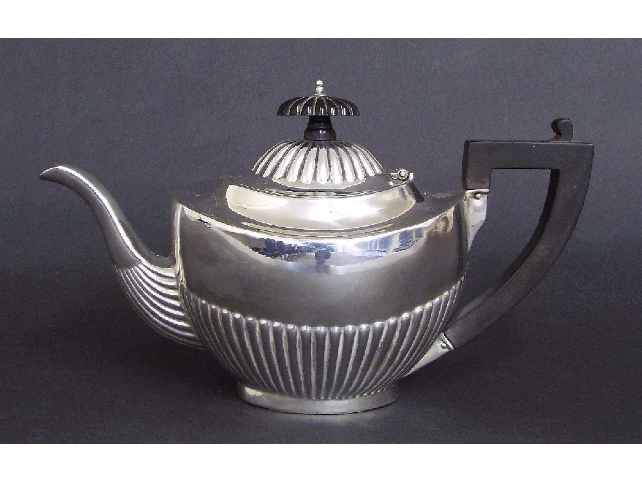 Appraisal: Edwardian silver half fluted bachelor teapot maker S W Smith