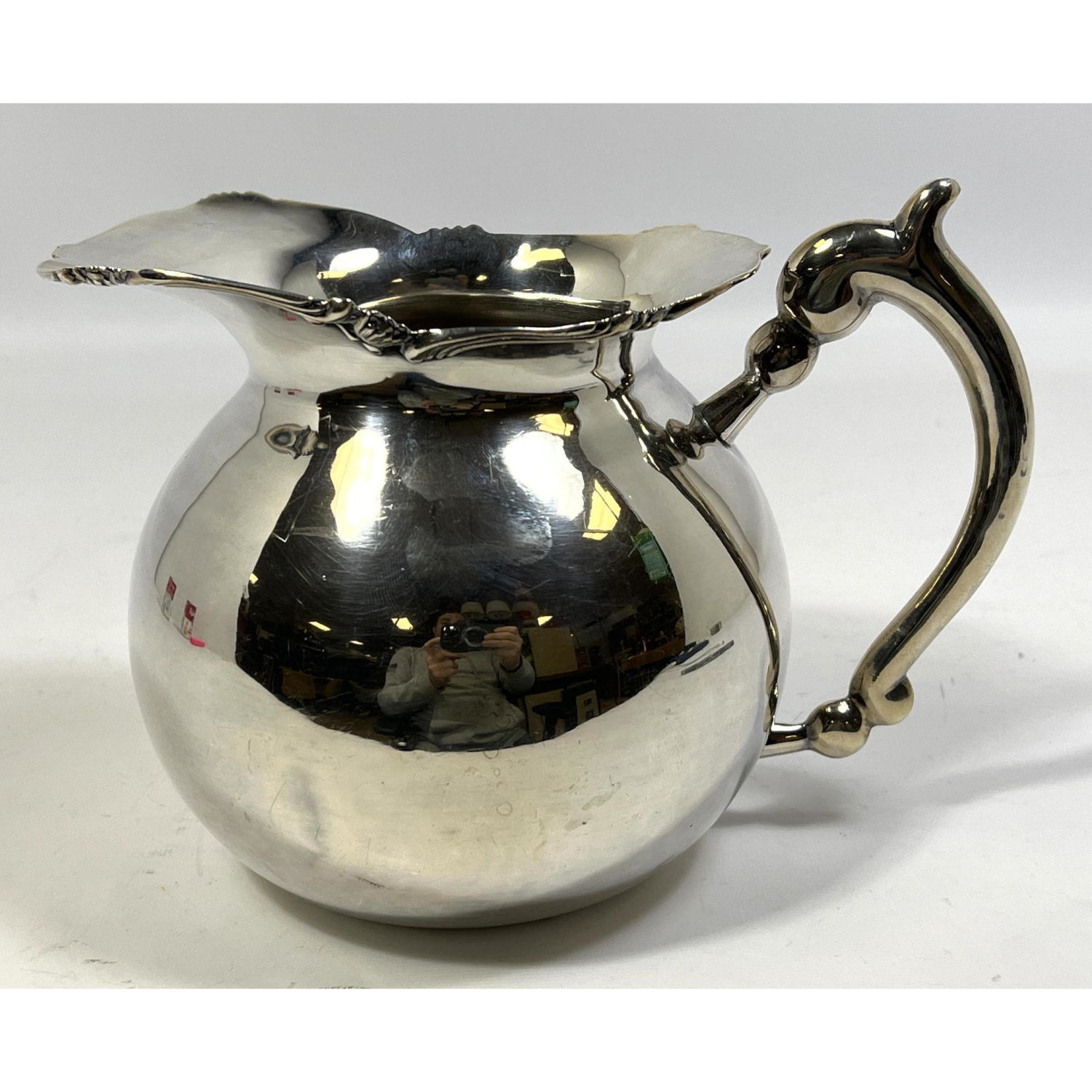 Appraisal: PERUVIAN STERLING SILVER WATER PITCHER STERLING CAMUSSO PERU Dimensions H