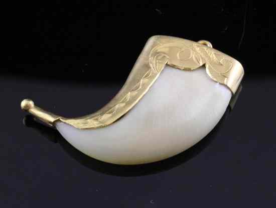 Appraisal: A gold mounted tiger's claw pendant in Estimate - Descriptions