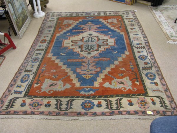 Appraisal: Hand woven wool rug with fringe measures by ' Generally