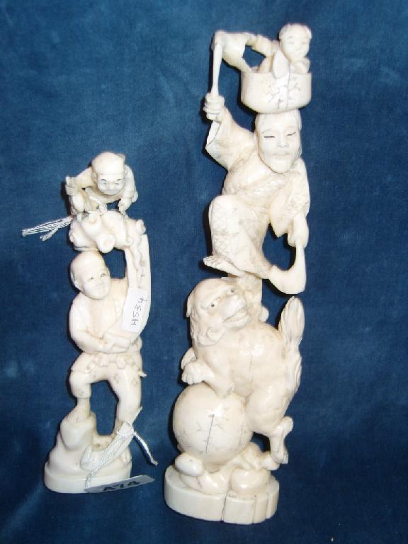 Appraisal: Two late th century Chinese ivory figures showing a man