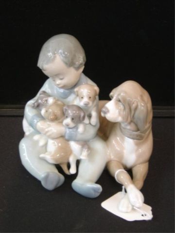 Appraisal: LLADRO FIGURINE - CHILD W DOG PUPPIES