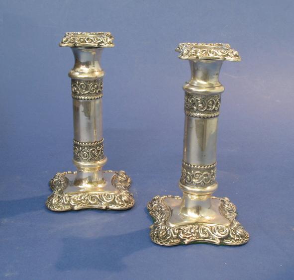 Appraisal: A PAIR OF LATE VICTORIAN CANDLESTICKS of cylindrical form with