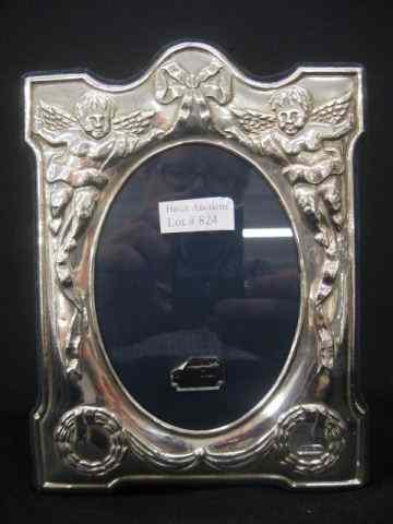 Appraisal: Sterling Silver Frame English hallmarks cherub and garland decor over